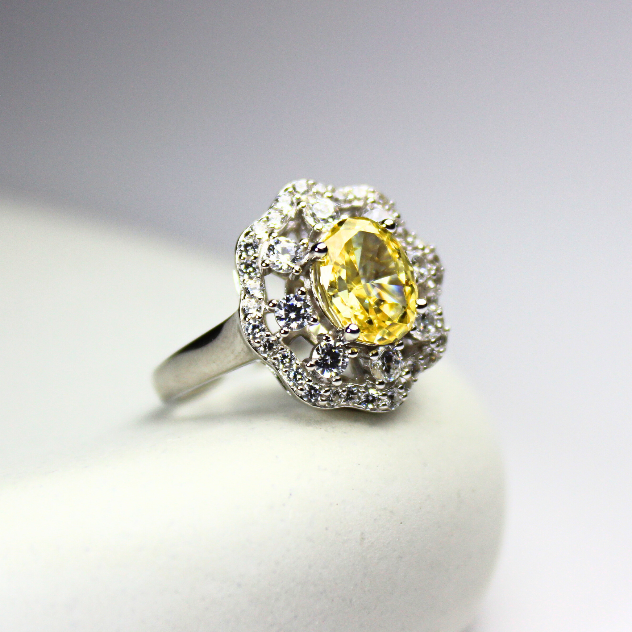 Saffra Ring in 92.5 sterling silver, featuring a stunning yellow gemstone surrounded by delicate sparkling diamonds. Tarnish-free, hypoallergenic, and perfect for sensitive skin—radiating warmth, elegance, and timeless charm.